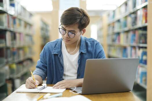 Student studying in library preparing for TOEFL